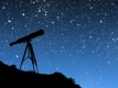 Telescope against starry backdrop